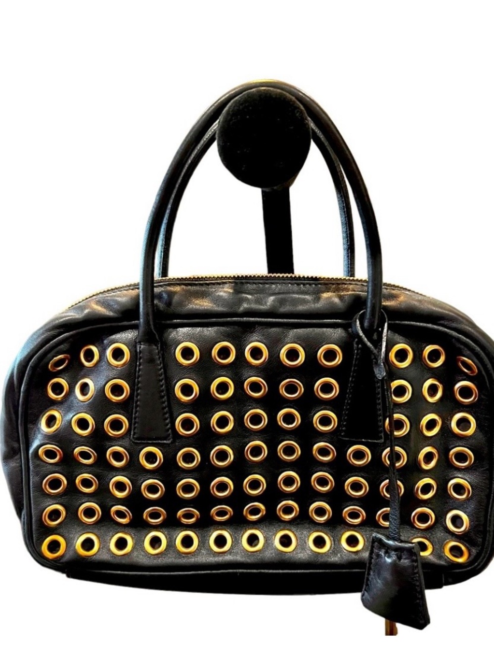 Prada Enameled Metal
Triangle Bauletto
Grommet